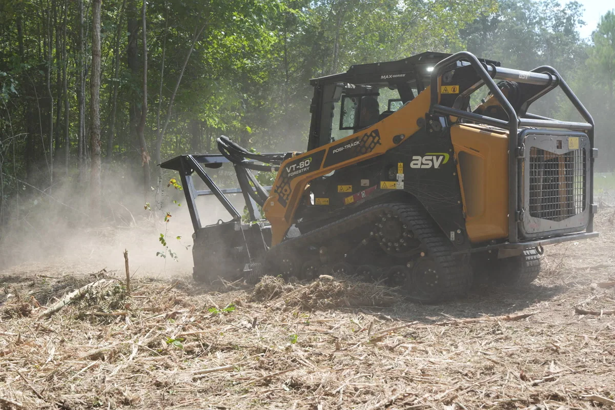 Clear Path ASV compact track loader with forestry mulcher attachment operating in full action on a Middle Tennessee job site