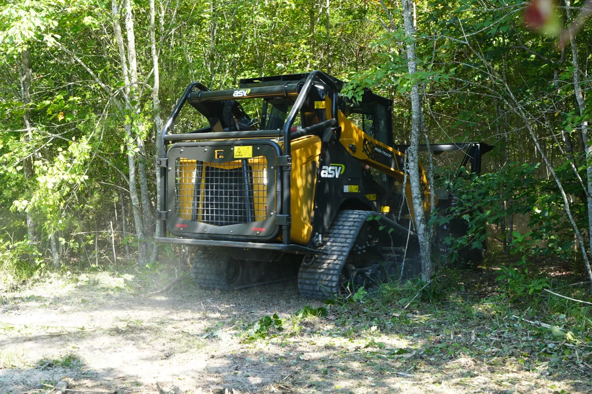 Clear Path Land Management forestry mulcher pushing into wooded perimeter on a Middle Tennessee property