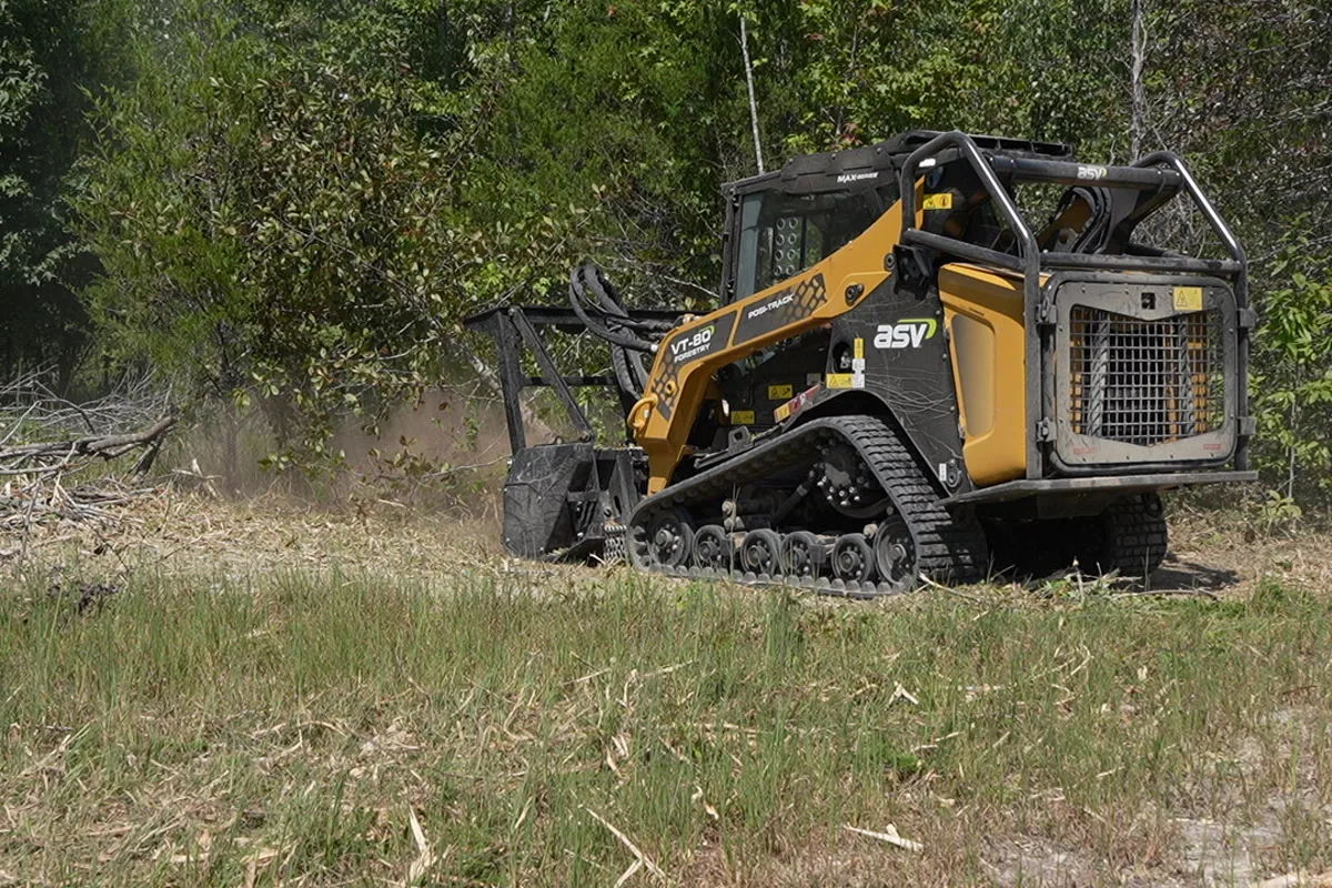 Clear Path compact track loader traversing freshly cleared land after a forestry mulching pass in Middle Tennessee